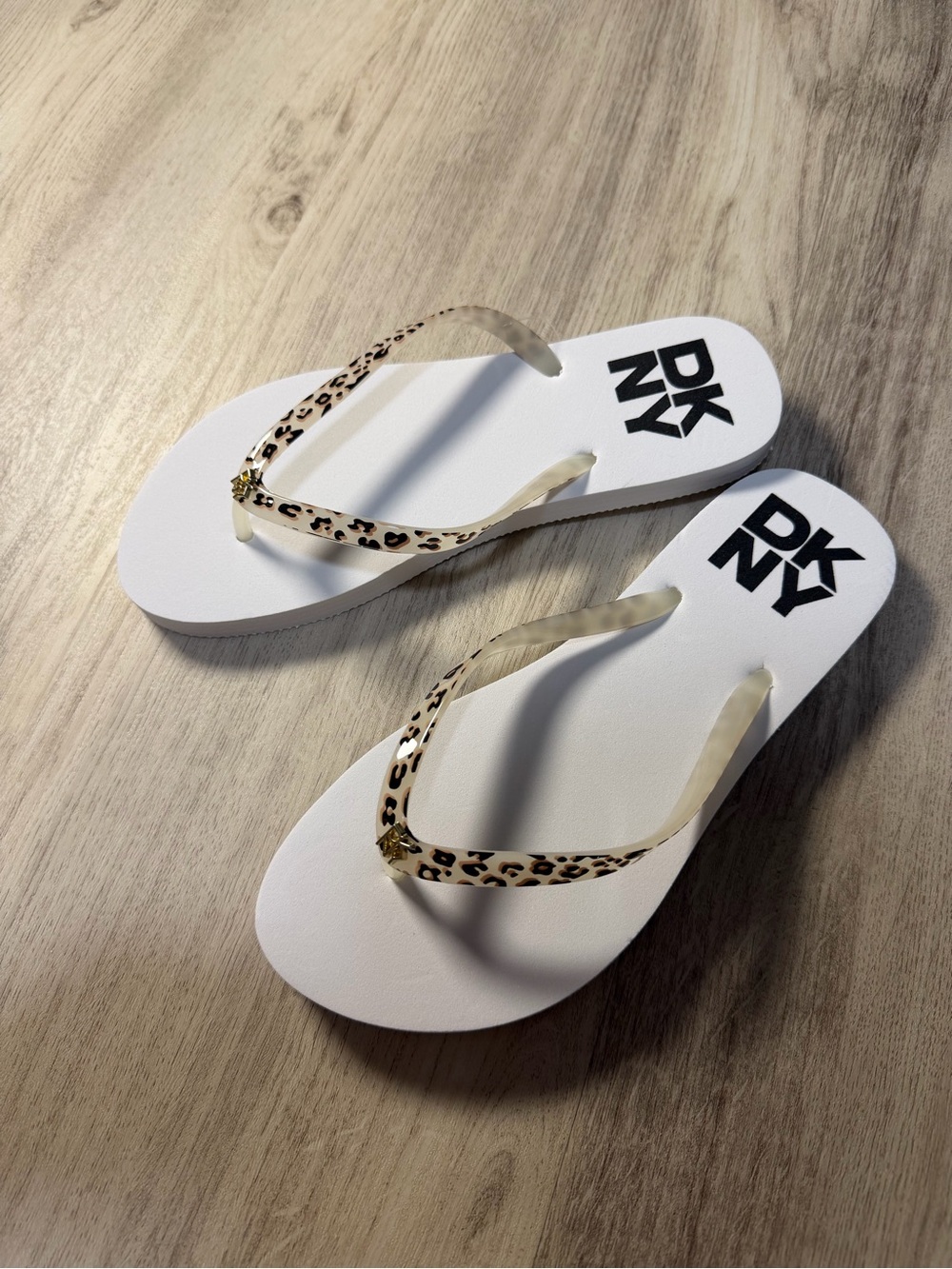 DKNY White Flip Flops with Leopard-Print Straps and Gold Accent